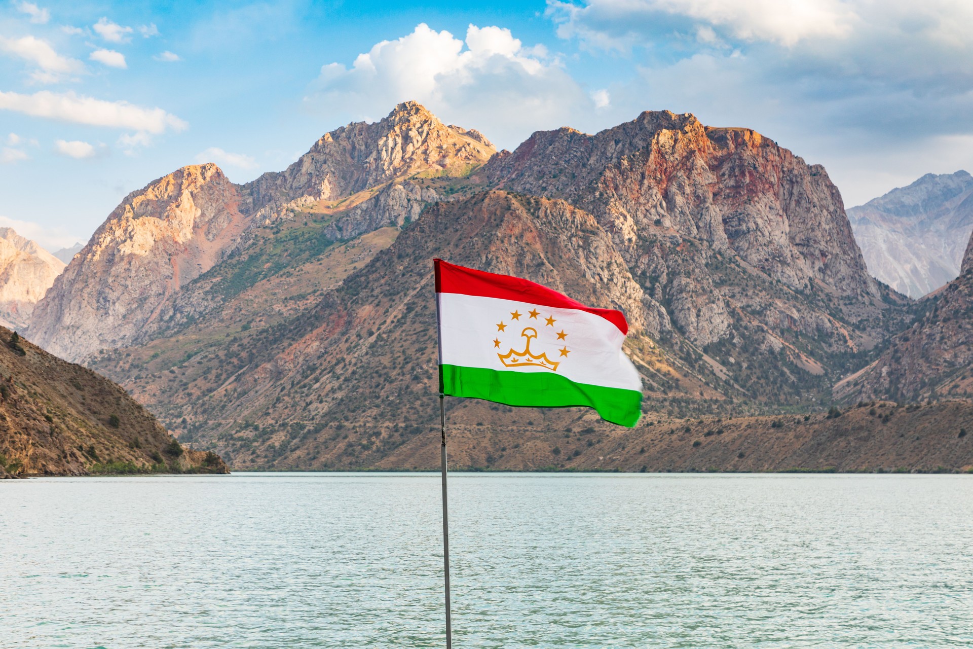 Tajik flag and mountain at Iskanderkul Lake.